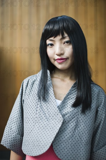 Asian woman in fashionable jacket