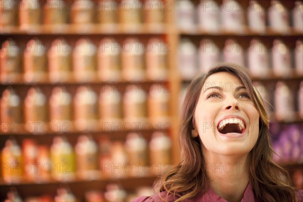 Caucasian woman looking up and laughing