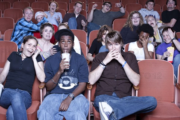 Friends watching movie in theater