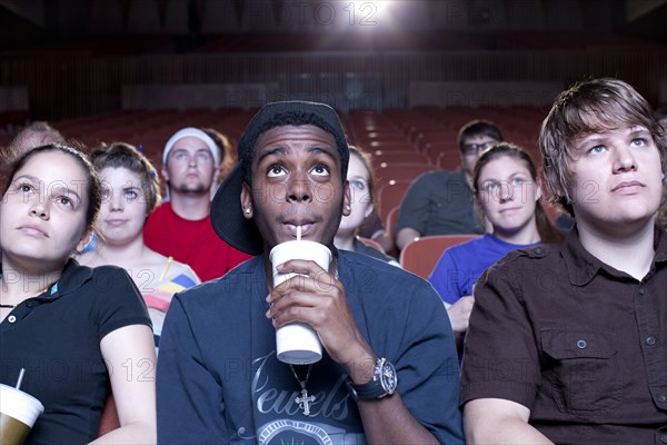 Friends watching movie in theater