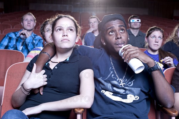 Friends watching movie in theater