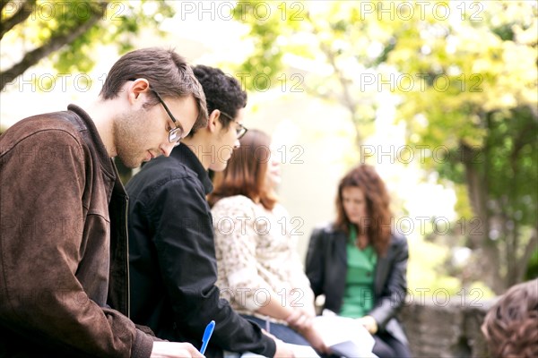 Students studying together outdoors