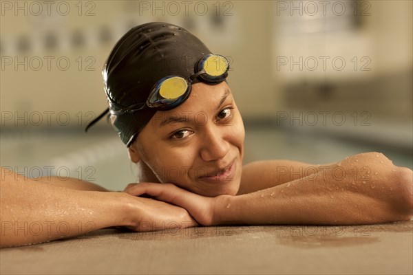 Pacific Islander swimmer in swimming pool