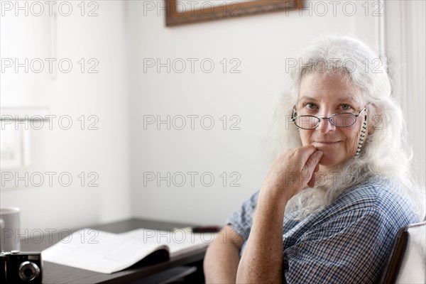 Caucasian woman sitting desk