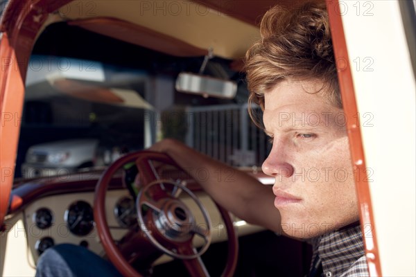 Caucasian man sitting in truck