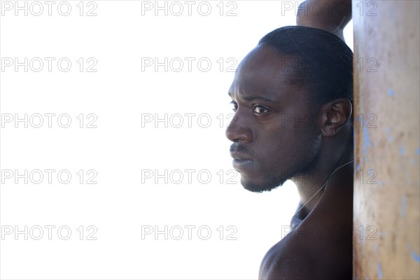 Serious Black man standing outdoors