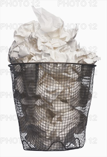 Wastepaper basket full of garbage