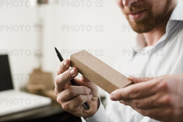 Caucasian businessman looking at prototype