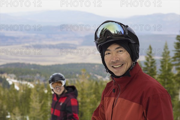 Men wearing ski gear in snow