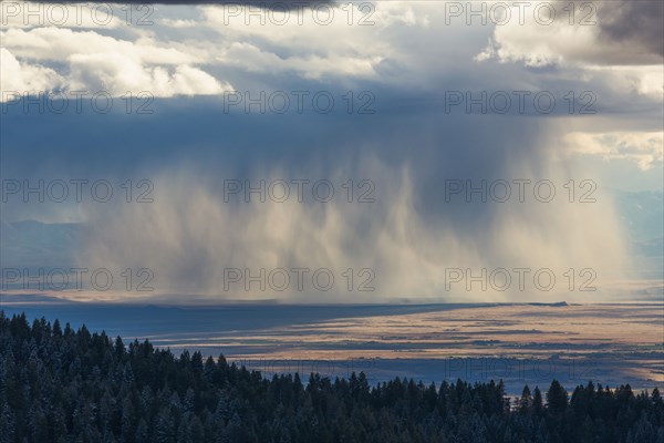 Storm clouds over rural valley