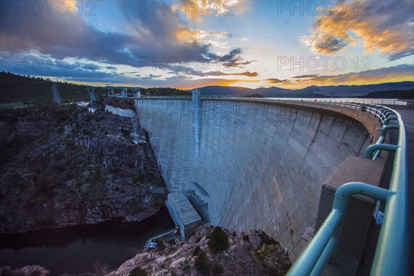 Sun rising over dam