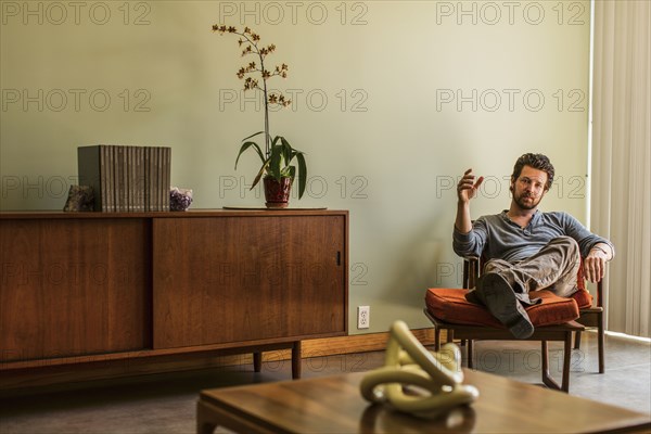 Caucasian man relaxing in living room