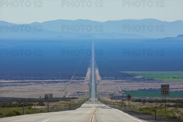 Long road through rural landscape