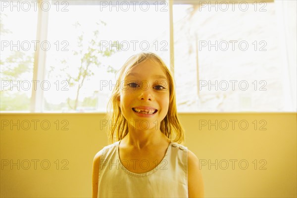 Caucasian girl showing gaps in teeth