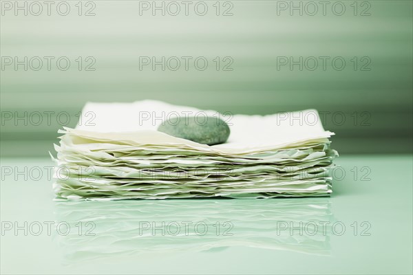 Stone on papers