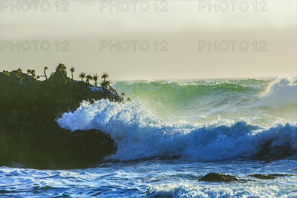 Waves crashing on cliffs