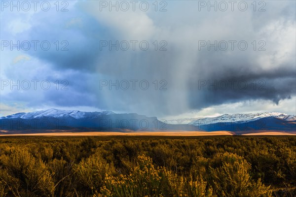 Storm clouds moving across rural prairie