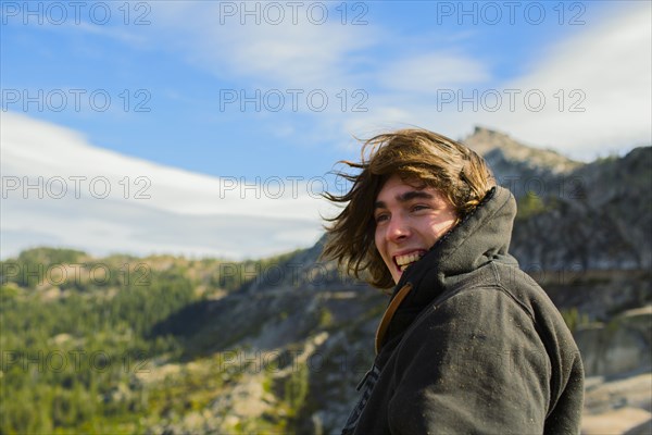Caucasian man smiling in rural landscape