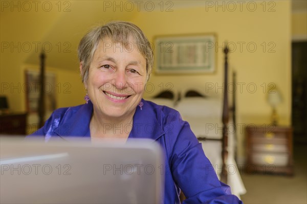 Senior Caucasian woman using laptop