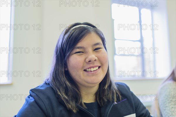 Native American student smiling in class
