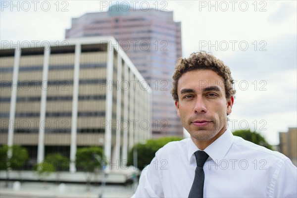 Hispanic businessman in city