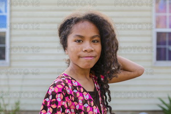 Pacific Islander girl smiling outdoors