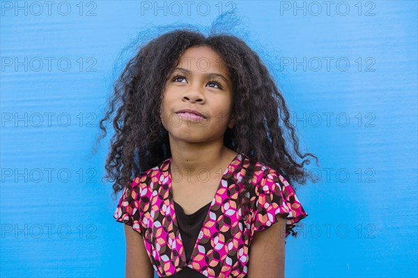 Pacific Islander girl looking up