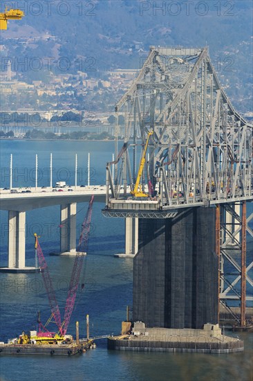 Bridge under construction over bay