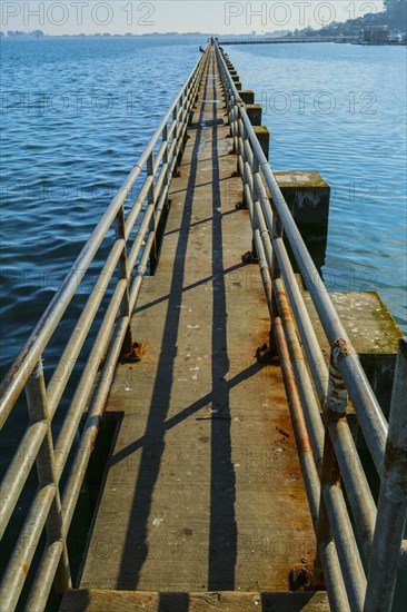 High angle view of concrete walkway over bay