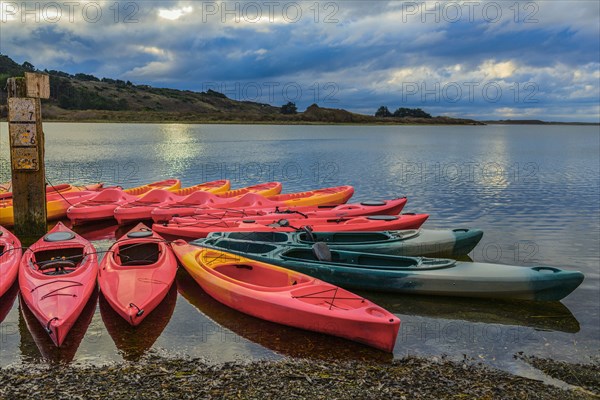 Empty canoes on calm remote lake