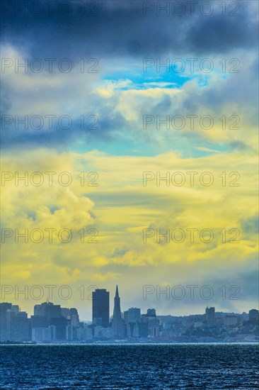 Silhouette of San Francisco city skyline under sunset sky