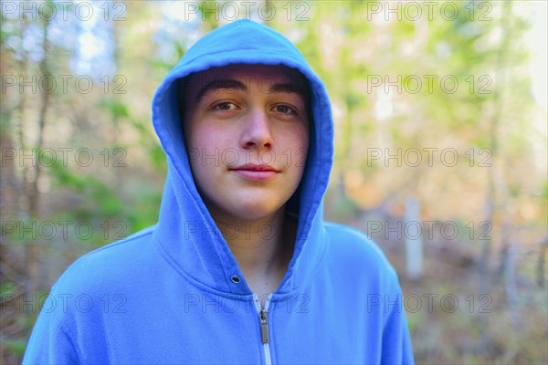 Caucasian teenage boy in forest