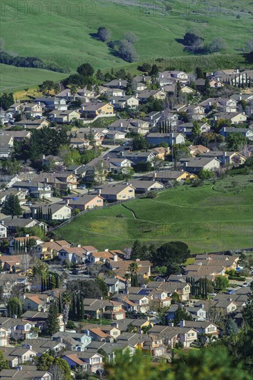 Aerial view of suburban neighborhood in rolling landscape