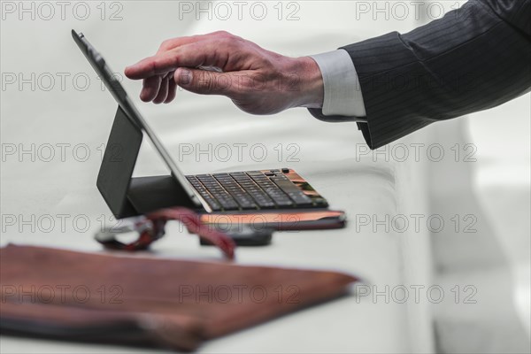 Caucasian businessman using digital tablet