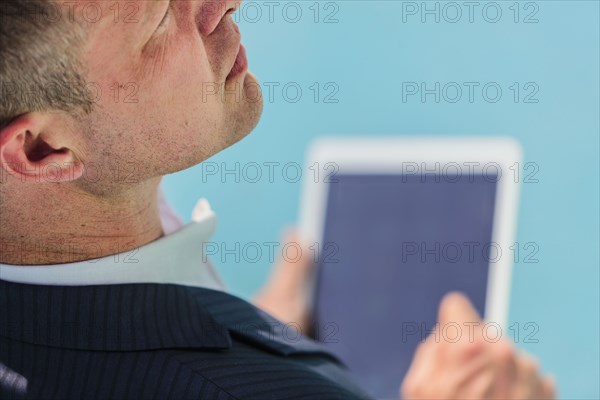 Caucasian businessman using digital tablet