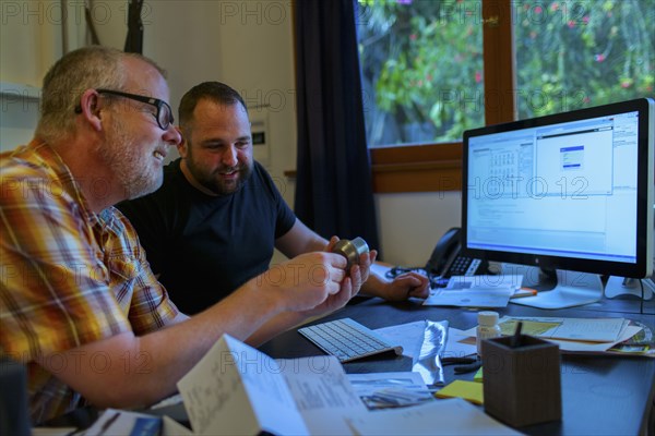 Caucasian businessmen working at desk