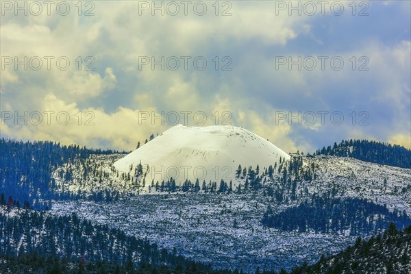 Snowy mountains under clouds