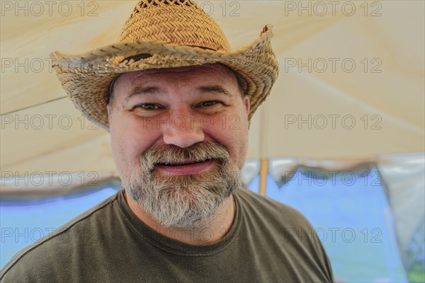 Caucasian man wearing cowboy hat