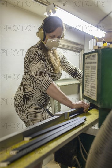 Caucasian artist working in workshop