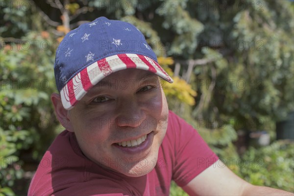 Mixed race man smiling outdoors