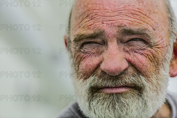 Close up of wrinkled face of Caucasian man