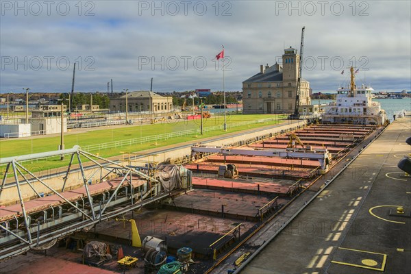 Crane and shipping containers in ship yard