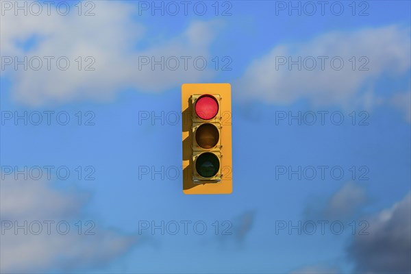 Stoplight floating in sky