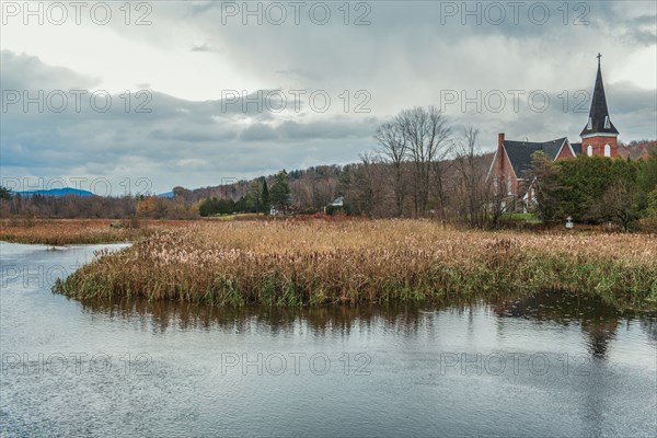 River and church in rural landscape