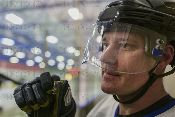 Caucasian hockey player wearing helmet