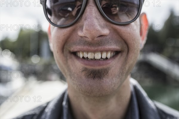 Close up of smiling Caucasian man with soul patch