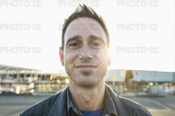 Caucasian man smiling outdoors