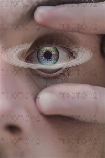 Saturn ring around eye of Hispanic man