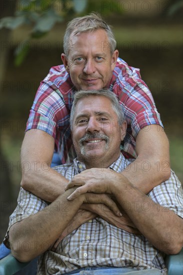 Portrait of smiling Caucasian men hugging