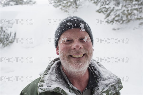 Caucasian man covered with ice and snow